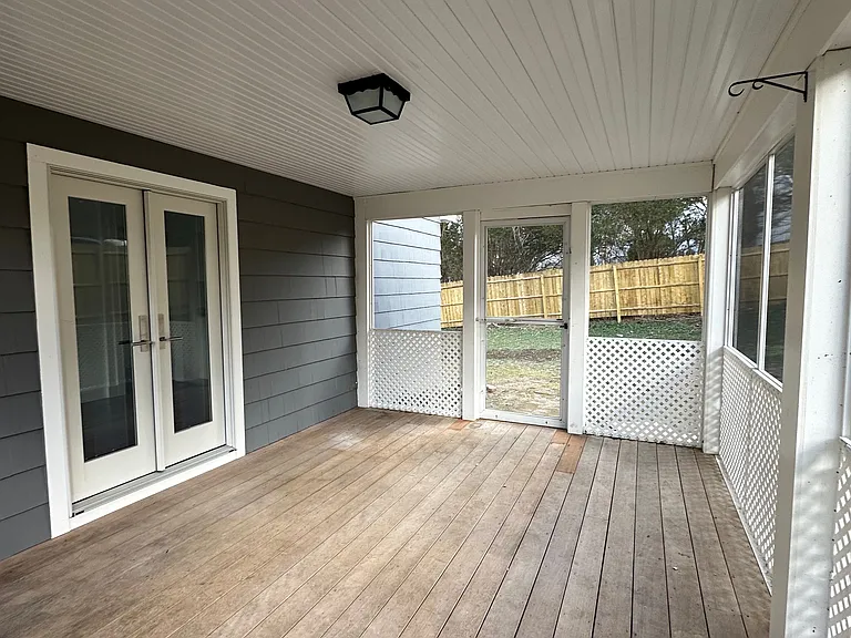 Screened in, three season porch, with access to private back yard and front yard. Access from kitchen/dining room via French doors.