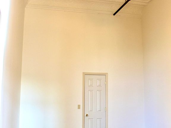 Master bedroom. Hardwood floors, 20-ft. stamped ceilings. Closet.