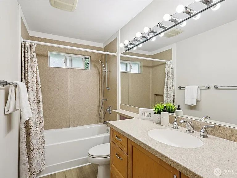 bathroom 2 on upper level with a tall cabinet