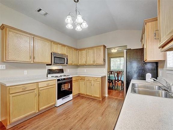 Oodles of counter space makes preparing meals a simple pleasure. Lot of storage! Quartz counters, stainless range, dishwasher installed in July.