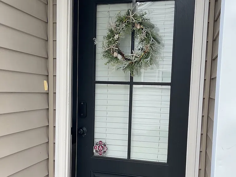 View from sidewalk, of front door entryway.