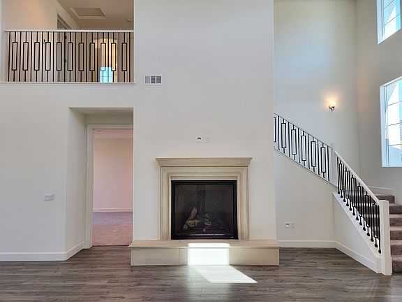 Photo shows similar floor plan from a different lot