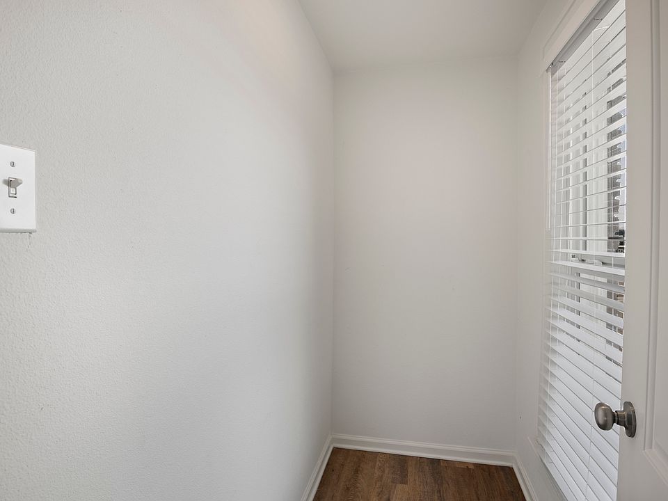 small room with window just off of the living room. Could be used as a small office or storage space.