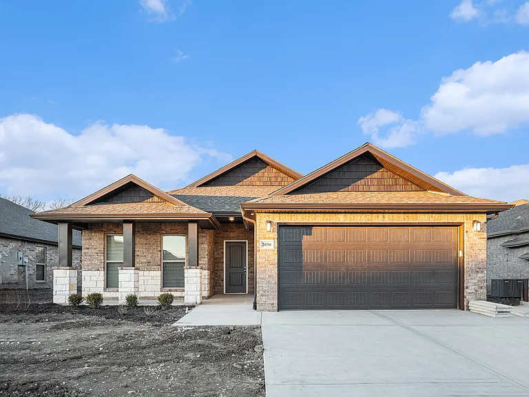 This photo was taken February 2024 before sod was laid after the new construction home build was complete. Home now has beautiful grass, complete sprinkler system and landscaping in the front of the home.