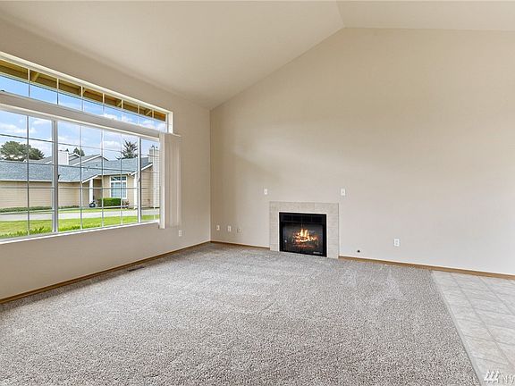 The vaulted living room is awash in natural light. 
