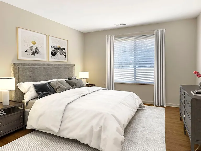 Bedrooms with hard surface flooring in select homes