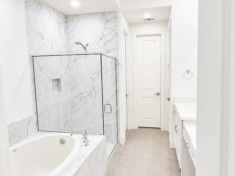Master Bathroom with Standing shower and Drop In bath tub.