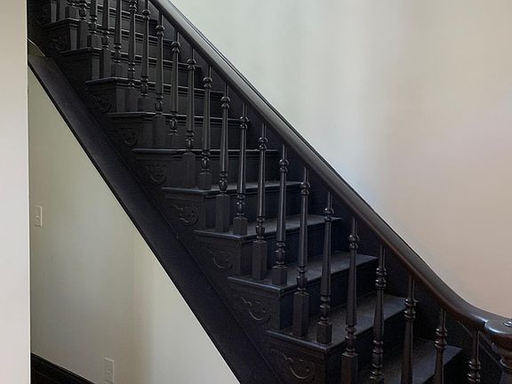 Original staircase refinished in black