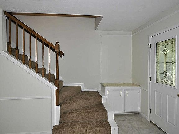 Stairs to full bathroom & 3 big bedrooms.