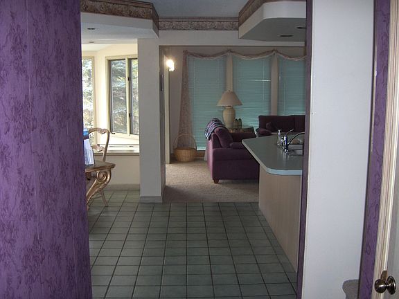 Entrance hall, showing eating area, sunroom, living room & kitchen