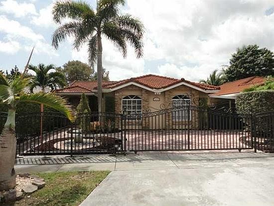 Exterior. Electric gate. Front yard is beautifully landscaped