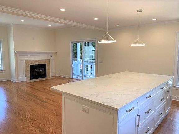 Views from Kitchen to Family Room w/Sliders to Deck