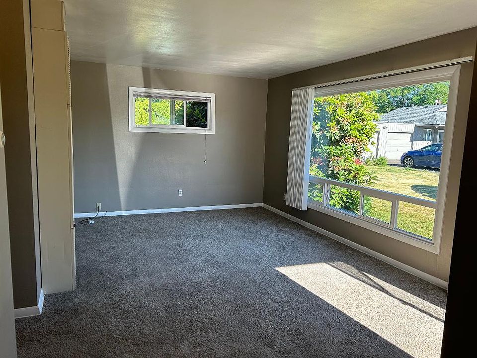 living room with large window and lots of natural light