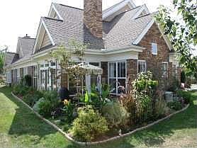 Rear with patio and landscaping