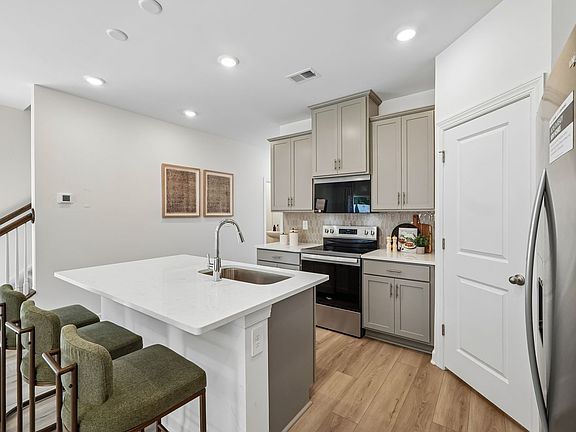 Turn the oversized kitchen island into a bar counter for additional seating.