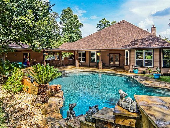 Complete with extended outdoor living space and a sparkling 48,000 gallon pool!