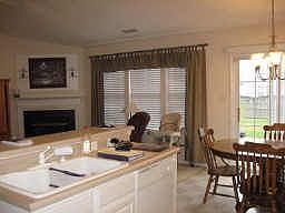 You can watch the news and enjoy your cozy fireplace while preparing meals