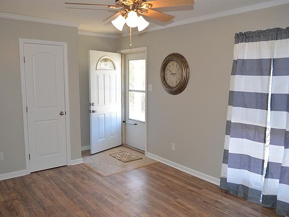 Formal dining or living room at entry.