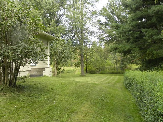 Large backyard, backs to woods and walking trails.