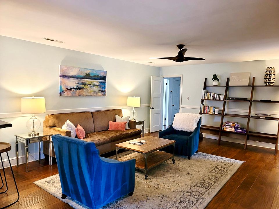 Cozy den, open to kitchen and has access to the back porch