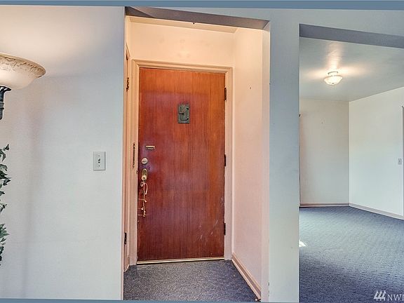 In the foyer, is a convenient coat closet. 