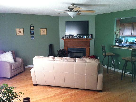 Living room complete with fireplace and breeze-through