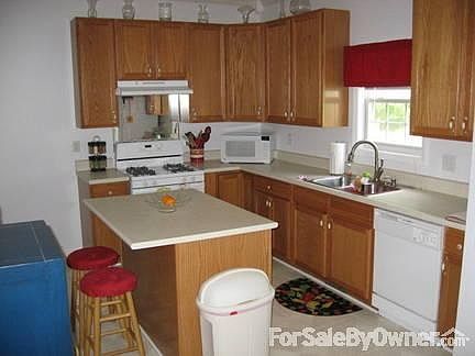Large Kitchen with Pantry
						:
						42" Oak cabinets, large kitchen island with eat-in area, gas range included !.