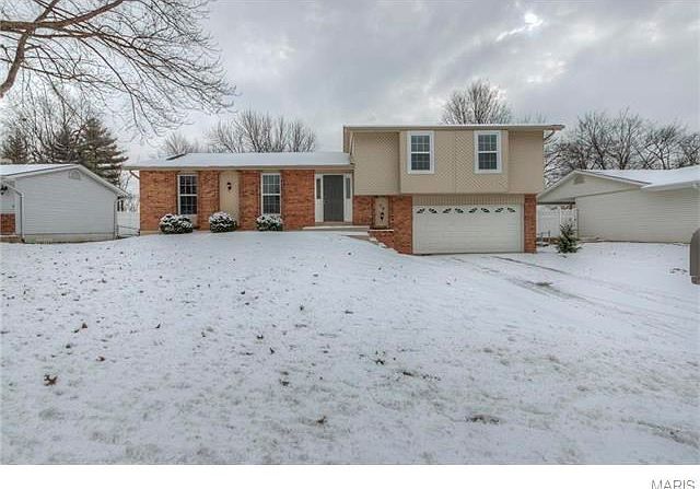 Nicely rehabbed side split with 4 levels! 3 bedrooms, 3 bath, 2-car garage.