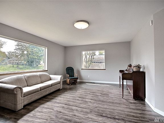 Large windows afford natural lighting and home has heat pump/air-conditioning.