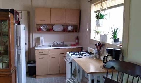 Kitchenette area is adjacent bathroom and laundry
