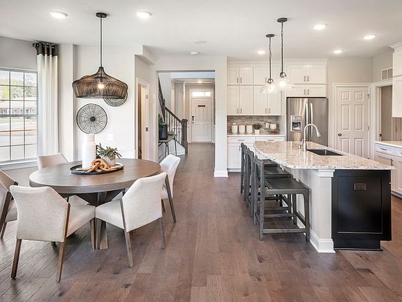 Kitchen with eat-in cafe in the Northbrook new construction townhome