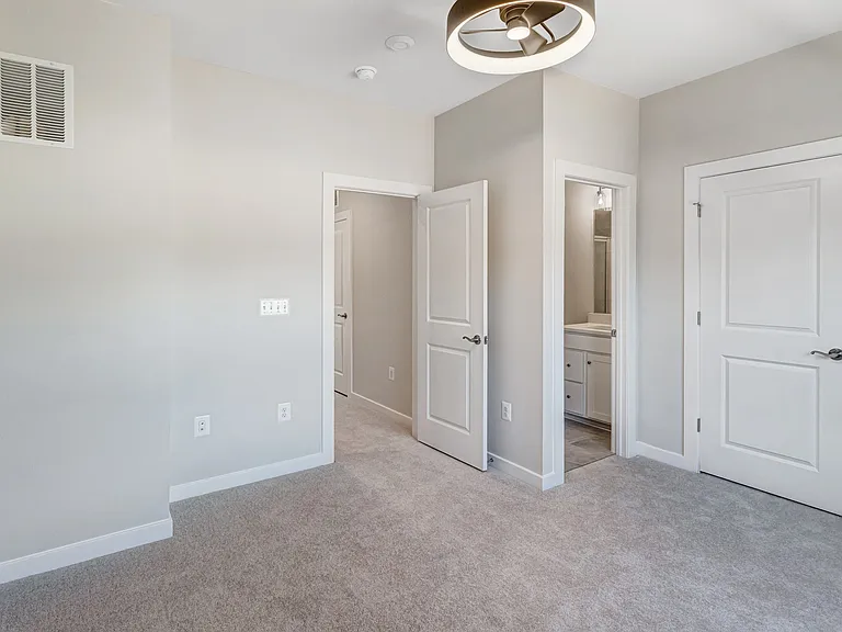 Generously sized primary bedroom designed for comfort, relaxation, and privacy.