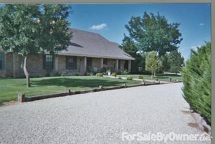 Lovely Landscaped Home!
						:
						Lots of Extras Outside. Cross Ties; Iron Gates at either side of drive.