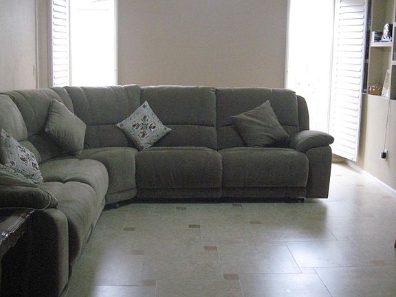 Family Room with wooden shutters, tile