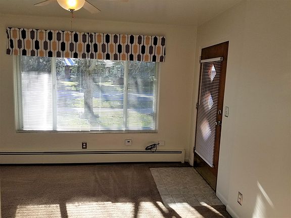 Living room, blinds open.