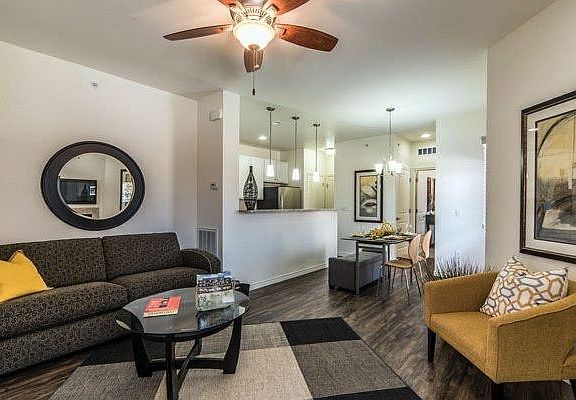 Living room, dining room, and kitchen have Shaw LPV flooring