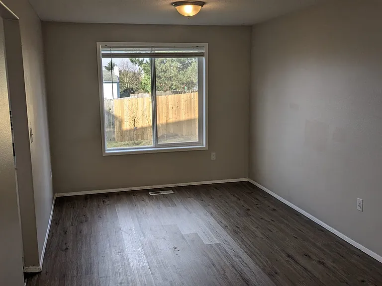 Living room view window facing backyard with new Luxury Vinyl Flooring