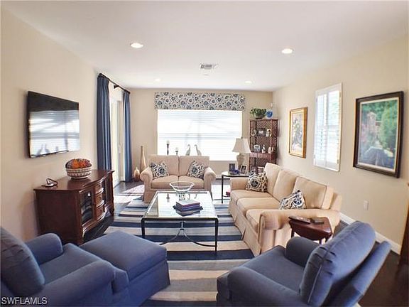 Great Room w/ Hunter Douglas Shade & Plantation Shutters