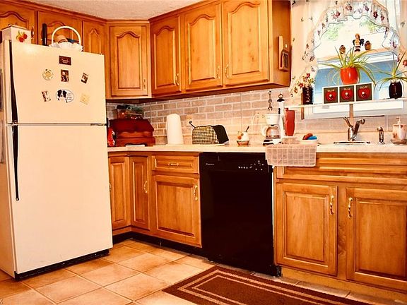 The kitchen has ample cabinet space.