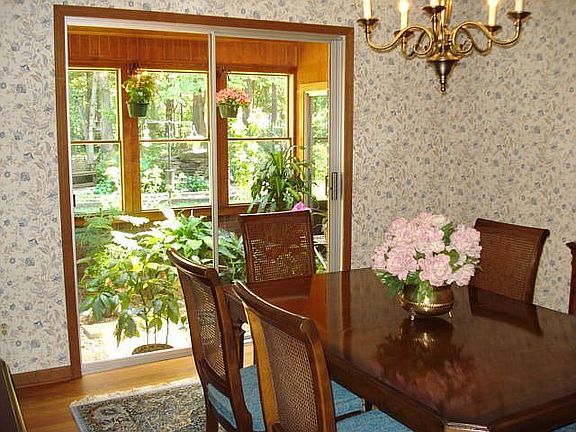Dining Room that looks into greenhouse.