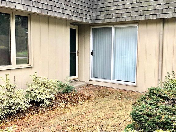 Front door to the left, and on the right a double sliding do