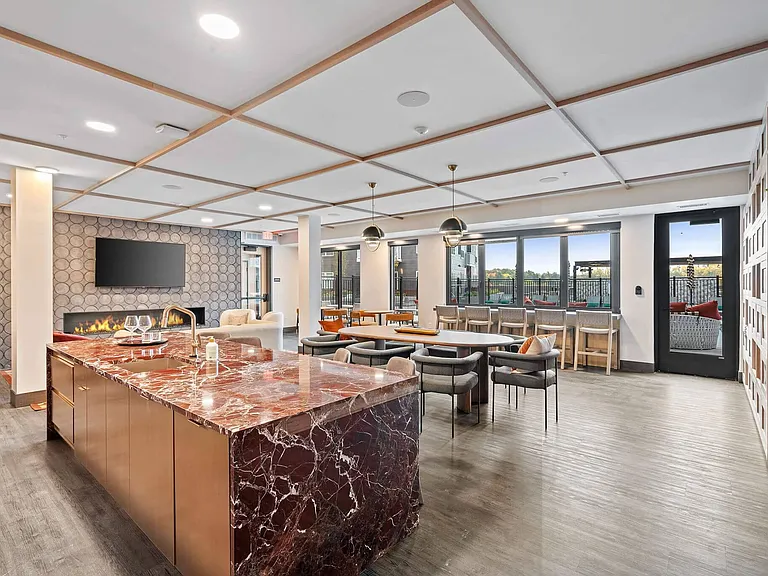 Resident Lounge with Kitchen & Plenty of Seating at The Hallon Luxury Apartments in Hopkins MN | apartments near St Louis Park MN