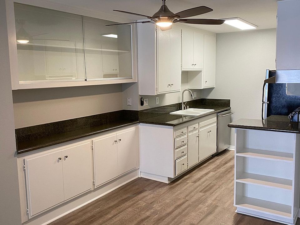 Kitchen Area with Extra Built Ins. Stainless Dishwasher.