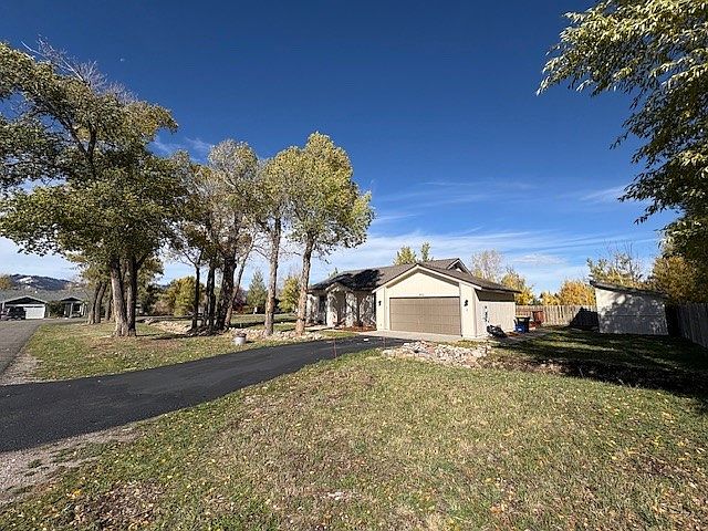 Located on a 0.4 acre corner lot