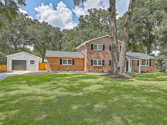 1.5 car garage with 2 storage rooms, sink and partially floored attic.