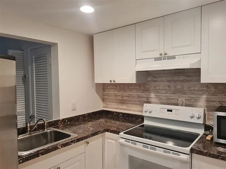 300 Golden Isles Dr #104 — Photo 7
