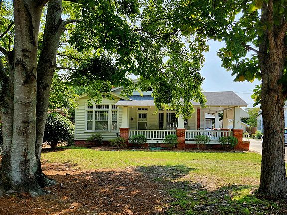 Exterior front with shade trees