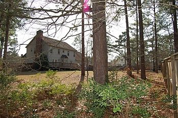 Back yard with old roof showing