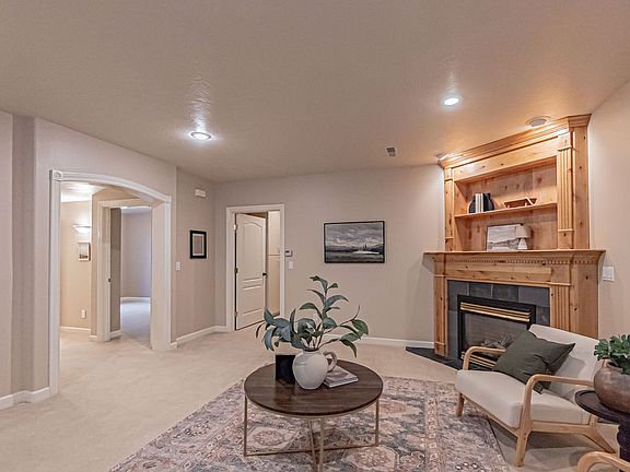 Family room adjacent to 2 bedrooms, 1 bathroom, and under stairs storage area