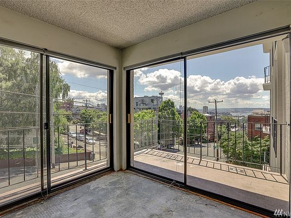 Sliders on the southeast corner of the building provide lots of natural light to this unit